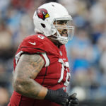 Arizona Cardinals guard Will Hernandez leaves the field after getting disqualify during the second half of an NFL football game against the Carolina Panthers on Sunday, Oct. 2, 2022, in Charlotte, N.C. (AP Photo/Rusty Jones)