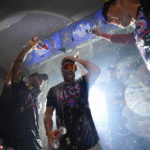 Philadelphia Phillies designated hitter Bryce Harper is doused after a win over the Atlanta Braves in Game 4 of baseball's National League Division Series, Saturday, Oct. 15, 2022, in Philadelphia. The Philadelphia Phillies won, 8-3. (AP Photo/Matt Slocum)