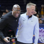 
              Golden State Warriors head coach Steve Kerr, right, laughs with former Warriors assistant coach and Sacramento Kings head coach Mike Brown, left, after Brown received his 2021-2022 NBA Championship ring before an NBA basketball game between the Warriors and the Kings, Sunday, Oct. 23, 2022, in San Francisco. (AP Photo/Tony Avelar)
            
