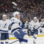 
              Tampa Bay Lightning's Ross Colton, center, celebrates his goal against the Columbus Blue Jackets during the first period of an NHL hockey game Friday, Oct. 14, 2022, in Columbus, Ohio. (AP Photo/Jay LaPrete)
            
