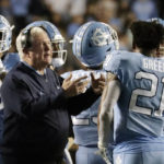 
              North Carolina head coach Mack Brown calls to his players as a play is reviewed during the second half of an NCAA college football game against Pittsburgh in Chapel Hill, N.C., Saturday, Oct. 29, 2022. (AP Photo/Chris Seward)
            