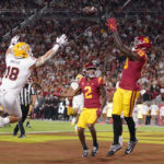 Southern California tight end Malcolm Epps, right, catches a touchdown pass as Arizona State linebacker Connor Soelle, left, and wide receiver Brenden Rice watches during the first half of an NCAA college football game Saturday, Oct. 1, 2022, in Los Angeles. (AP Photo/Mark J. Terrill)
