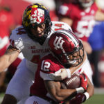 
              Indiana running back Jaylin Lucas (12) is tackled by Maryland's Caleb Wheatland (44) during the first half of an NCAA college football game, Saturday, Oct. 15, 2022, in Bloomington, Ind. (AP Photo/Darron Cummings)
            