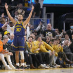 Golden State Warriors guard Stephen Curry (30) raises his arms after making a 3-point shot against the Sacramento Kings during the first half of an NBA basketball game on Sunday, Oct. 23, 2022 in San Francisco. (AP Photo/Tony Avelar)