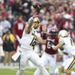 
              Missouri quarterback Brady Cook (12) throws a short pass during the first half of an NCAA college football game against South Carolina, Saturday, Oct. 29, 2022, in Columbia, S.C. (AP Photo/Artie Walker Jr.)
            