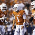 Texas tight end Ja'Tavion Sanders (0) celebrates his touchdown against West Virginia with quarterback Hudson Card (1) and offensive lineman Hayden Conner (76) during the first half of an NCAA college football game Saturday, Oct. 1, 2022, in Austin, Texas. (AP Photo/Stephen Spillman)