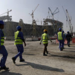 
              Workers walk to the Lusail Stadium, one of the 2022 World Cup stadiums, in Lusail, Qatar, Dec. 20, 2019. A former CIA officer who spied on Qatar’s rivals to help the tiny Arab country land this year’s World Cup is now under FBI scrutiny and newly obtained documents show he offered clandestine services that went beyond soccer to try to influence U.S. policy, an Associated Press investigation found. (AP Photo/Hassan Ammar)
            