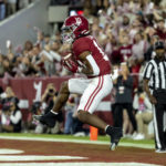 
              Alabama wide receiver JoJo Earle (10) catches a touchdown pass during the first half of the team's NCAA college football game against Mississippi State, Saturday, Oct. 22, 2022, in Tuscaloosa, Ala. (AP Photo/Vasha Hunt)
            