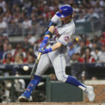 
              New York Mets' Jeff McNeil hits a single against the Atlanta Braves during the first inning of a baseball game Saturday, Oct. 1, 2022, in Atlanta. (AP Photo/Brett Davis)
            