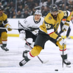 
              Vegas Golden Knights' Keegan Kolesar moves the puck past Los Angeles Kings' Blake Lizotte during the first period of an NHL hockey game Tuesday, Oct. 11, 2022, in Los Angeles. (AP Photo/Jae C. Hong)
            