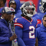 New York Giants quarterback Tyrod Taylor (2) is helped off the field after an injury during the fourth quarter of an NFL football game against the Chicago Bears, Sunday, Oct. 2, 2022, in East Rutherford, N.J. (AP Photo/Seth Wenig)