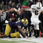 
              Stanford wide receiver Elijah Higgins, right, jumps as he runs with the ball past Notre Dame safety Brandon Joseph during the second half of an NCAA college football game in South Bend, Ind., Saturday, Oct. 15, 2022. Stanford won 16-14. (AP Photo/Nam Y. Huh)
            