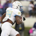 
              Southern University running back Jerodd Sims (24) runs for a first down against Jackson State during the first half of an NCAA college football game in Jackson, Miss., Saturday, Oct. 29, 2022. (AP Photo/Rogelio V. Solis)
            