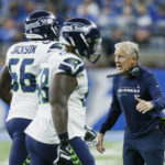 
              Seattle Seahawks head coach Pete Carroll greets his players during the first half of an NFL football game against the Detroit Lions, Sunday, Oct. 2, 2022, in Detroit. (AP Photo/Duane Burleson)
            
