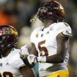Arizona State defensive back Chris Edmonds, celebrates his pass interception with linebacker Will Shaffer in the second half of an NCAA college football game against Colorado, Saturday, Oct. 29, 2022, in Boulder, Colo. (AP Photo/David Zalubowski)
