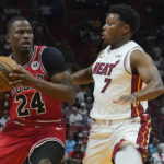 Chicago Bulls forward Javonte Green (24) looks to pass the ball as Miami Heat guard Kyle Lowry (7) defends during the first half of an NBA game Wednesday, Oct. 19, 2022, in Miami. (AP Photo/Marta Lavandier)