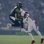 Seattle Seahawks wide receiver DK Metcalf (14) cannot catch a pass against Arizona Cardinals cornerback Byron Murphy Jr. during the first half of an NFL football game in Seattle, Sunday, Oct. 16, 2022. (AP Photo/Abbie Parr)