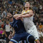 Memphis Grizzlies forward Santi Aldama (7) and Utah Jazz forward Kelly Olynyk (41) battle for position under the boards during the first half of an NBA basketball game Saturday, Oct. 29, 2022, in Salt Lake City. (AP Photo/Rick Bowmer)