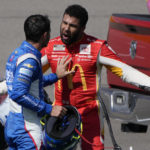 Bubba Wallace, right, argues with Kyle Larson after the two crashed during a NASCAR Cup Series auto race Sunday, Oct. 16, 2022, in Las Vegas. (AP Photo/John Locher)