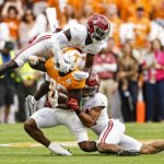 
              Tennessee tight end Princeton Fant (88) is tackled by Alabama defensive back Terrion Arnold (3) and defensive back Brian Branch (14) during the first half of an NCAA college football game Saturday, Oct. 15, 2022, in Knoxville, Tenn. (AP Photo/Wade Payne)
            