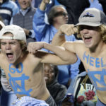 Young North Carolina fans cheer the team on against Pittsburgh during the second half of an NCAA college football game in Chapel Hill, N.C., Saturday, Oct. 29, 2022. (AP Photo/Chris Seward)