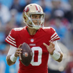 San Francisco 49ers quarterback Jimmy Garoppolo looks to pass during the first half an NFL football game against the San Francisco 49ers on Sunday, Oct. 9, 2022, in Charlotte, N.C. (AP Photo/Rusty Jones)