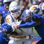
              Iowa State wide receiver Xavier Hutchinson (8) is tackled by Kansas linebacker Rich Miller (30) and Kansas safety O.J. Burroughs (5) during the first half of an NCAA college football game, Saturday, Oct. 1, 2022, in Lawrence, Kan. (AP Photo/Reed Hoffmann)
            