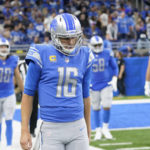 Detroit Lions quarterback Jared Goff (16) walks to the sideline after throwing an interception that returned for a touchdown during the second half of an NFL football game against the Seattle Seahawks, Sunday, Oct. 2, 2022, in Detroit. (AP Photo/Paul Sancya)