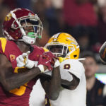 Southern California wide receiver Jordan Addison, left, is unable to catch a pass while under pressure from Arizona State defensive back Ro Torrence during the second half of an NCAA college football game Saturday, Oct. 1, 2022, in Los Angeles. Torrence was called for pass interference on the play. (AP Photo/Mark J. Terrill)