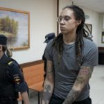 WNBA star and two-time Olympic gold medalist Brittney Griner is escorted from a court room after her last words, in Khimki just outside Moscow, Russia, on Aug. 4, 2022. (AP Photo/Alexander Zemlianichenko, File)
            