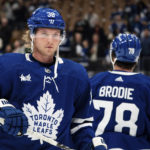 Toronto Maple Leafs defenseman Rasmus Sandin (38) and TJ Brodie (78) take part in warmups before NHL hockey game action against the Arizona Coyotes in Toronto, Monday, Oct. 17, 2022. (Alex Lupul/The Canadian Press via AP)