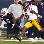 
              Arizona wide receiver Dorian Singer tries to make the catch in front of Southern California defensive back Mekhi Blackmon (6) in the first half during an NCAA college football game, Saturday, Oct. 29, 2022, in Tucson, Ariz. (AP Photo/Rick Scuteri)
            