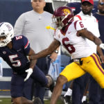 
              Arizona wide receiver Dorian Singer tries to make the catch in front of Southern California defensive back Mekhi Blackmon (6) in the first half during an NCAA college football game, Saturday, Oct. 29, 2022, in Tucson, Ariz. (AP Photo/Rick Scuteri)
            