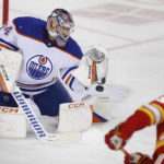 Edmonton Oilers goalie Stuart Skinner makes a save against Calgary Flames' Tyler Toffoli during the first period of an NHL hockey game in Calgary, Alberta, Saturday, Oct. 29, 2022. (Larry MacDougal/The Canadian Press via AP)