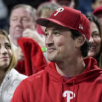 
              Actor, Miles Teller watches during the fourth inning in Game 3 of the baseball NL Championship Series between the San Diego Padres and the Philadelphia Phillies on Friday, Oct. 21, 2022, in Philadelphia. (AP Photo/Brynn Anderson)
            