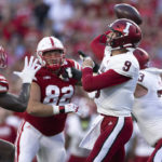 
              Indiana quarterback Connor Bazelak (9) passes the ball while under pressure from Nebraska edge rusher Caleb Tannor (2) during the first half of an NCAA college football game Saturday, Oct. 1, 2022, in Lincoln, Neb. (AP Photo/Rebecca S. Gratz)
            