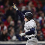 New York Yankees' Harrison Bader gestures after hitting a home run during the seventh inning of Game 3 of the baseball team's AL Division Series against the Cleveland Guardians, Saturday, Oct. 15, 2022, in Cleveland. (AP Photo/David Dermer)
