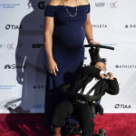 Elana Meyers Taylor poses for photos on the red carpet at the Women's Sports Foundation's Annual Salute to Women in Sports, Wednesday, Oct. 12, 2022, in New York. Meyers Taylor, who received the Wilma Rudolph Courage Award, is a four-time Olympic bobsledder and the most decorated Black athlete in the Winter Games with five medals. (AP Photo/Julia Nikhinson)