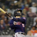 
              Minnesota Twins' Mark Contreras watches his solo home run during the fifth inning of a baseball game against the Detroit Tigers, Saturday, Oct. 1, 2022, in Detroit. (AP Photo/Carlos Osorio)
            