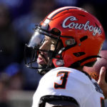 Oklahoma State quarterback Spencer Sanders throws during the first half of an NCAA college football game against Kansas State Saturday, Oct. 29, 2022, in Manhattan, Kan. (AP Photo/Charlie Riedel)