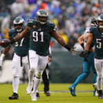Philadelphia Eagles' Fletcher Cox (91) celebrates recovering a fumble by Jacksonville Jaguars' Trevor Lawrence during the first half of an NFL football game Sunday, Oct. 2, 2022, in Philadelphia. (AP Photo/Matt Slocum)
