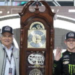 Ty Gibbs right, and track president Clay Campbell, left, pose with the trophy in Victory Lane after Gibbs won the NASCAR Xfinity series auto race at Martinsville Speedway, Saturday, Oct. 29, 2022, in Martinsville, Va. (AP Photo/Chuck Burton)