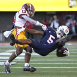 Southern California defensive back Jaylin Smith (19) tackles Arizona wide receiver Dorian Singer for a loss in the first half during an NCAA college football game, Saturday, Oct. 29, 2022, in Tucson, Ariz. (AP Photo/Rick Scuteri)