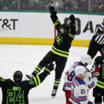 
              Dallas Stars left wing Jason Robertson, center, celebrates his goal against the New York Rangers during the second period of an NHL hockey game in Dallas, Saturday, Oct. 29, 2022. (AP Photo/Michael Ainsworth)
            