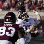 Texas A&M quarterback Max Johnson is hit from behind by a Mississippi State defender and looses the ball during the first half of an NCAA college football game in Starkville, Miss., Saturday, Oct. 1, 2022. (AP Photo/Rogelio V. Solis)