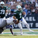 Tulane quarterback Michael Pratt (7) is tackled by Memphis linebacker Xavier Cullens (8) during the first half of an NCAA college football in New Orleans, Saturday, Oct. 22, 2022. (AP Photo/Tyler Kaufman)