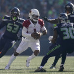 Arizona Cardinals quarterback Kyler Murray (1) scrambles against the Seattle Seahawks during the second half of an NFL football game in Seattle, Sunday, Oct. 16, 2022. (AP Photo/Abbie Parr)