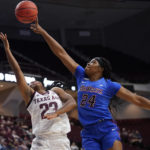 
              FILE - DePaul forward Aneesah Morrow (24) blocks a shot by Texas A&M guard McKinzie Green (23) during the first half of an NCAA college basketball game Monday, Nov. 15, 2021, in College Station, Texas. Morrow was named to the women's Associated Press preseason All-America team, Tuesday, Oct. 25, 2022. (AP Photo/Sam Craft, File)
            