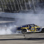 Chase Elliott does a burnout after winning a NASCAR Cup Series auto race, Sunday, Oct. 2, 2022, in Talladega, Ala. (AP Photo/Skip Williams)