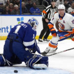 New York Islanders center Brock Nelson (29) watches his shot go wide of Tampa Bay Lightning goaltender Brian Elliott (1) during the first period of an NHL hockey game Saturday, Oct. 22, 2022, in Tampa, Fla. (AP Photo/Chris O'Meara)